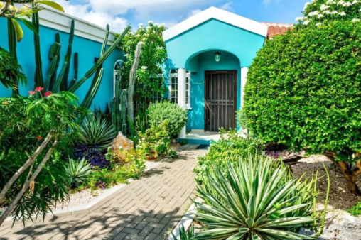 Local home bonaire blue house with tropical garden